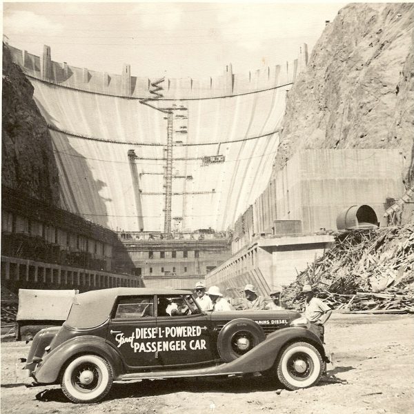 Clessie Cummins in the Cummins-powered Auburn 851, making a stop at the bottom of Hoover Dam during its construction in 1935.