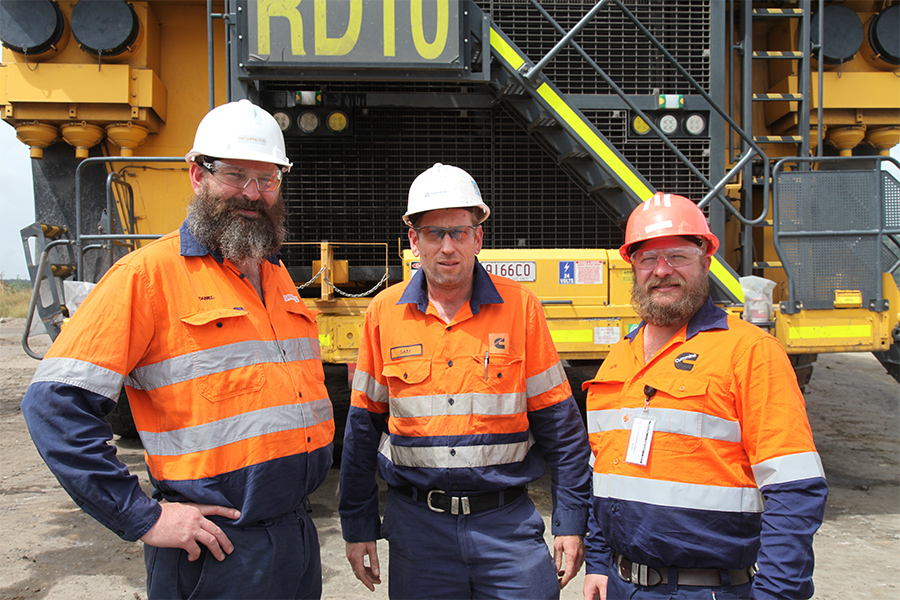 Employees standing in front of application