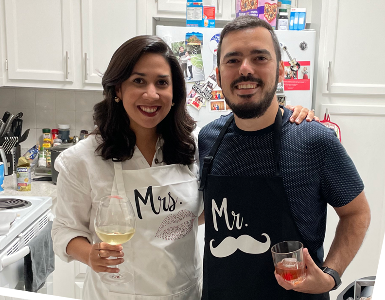 Carlos and his wife after cooking a holiday meal