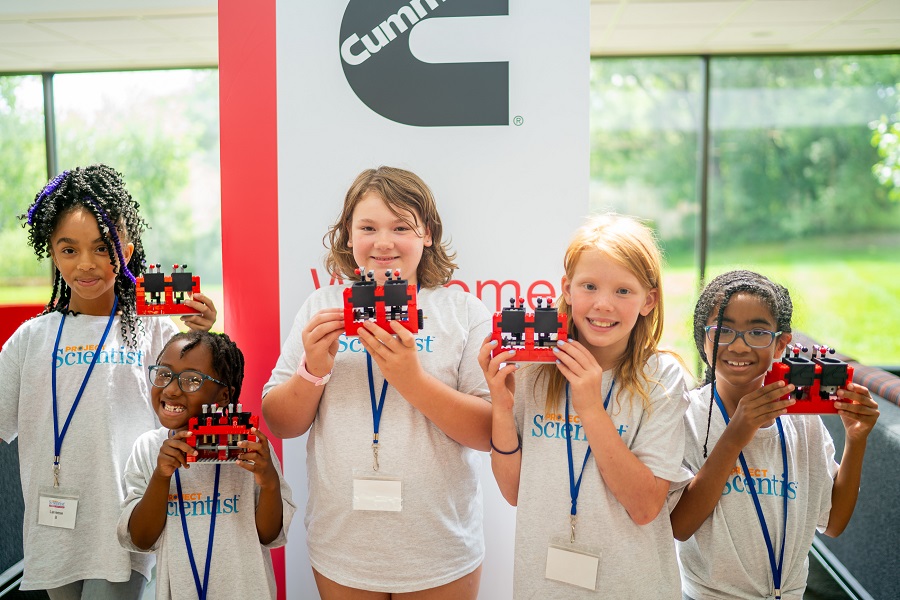 Students holding their engine replicas