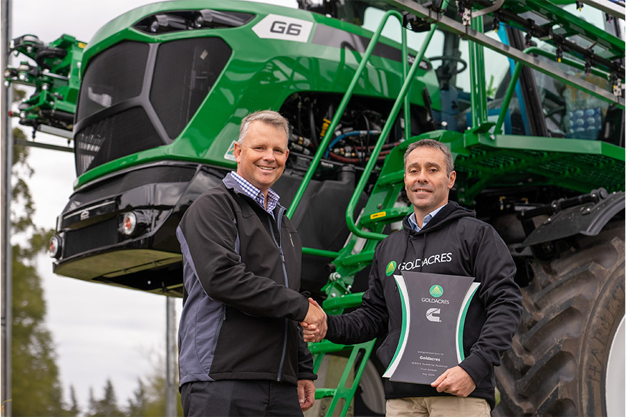 Customer shaking hands with Cummins representative