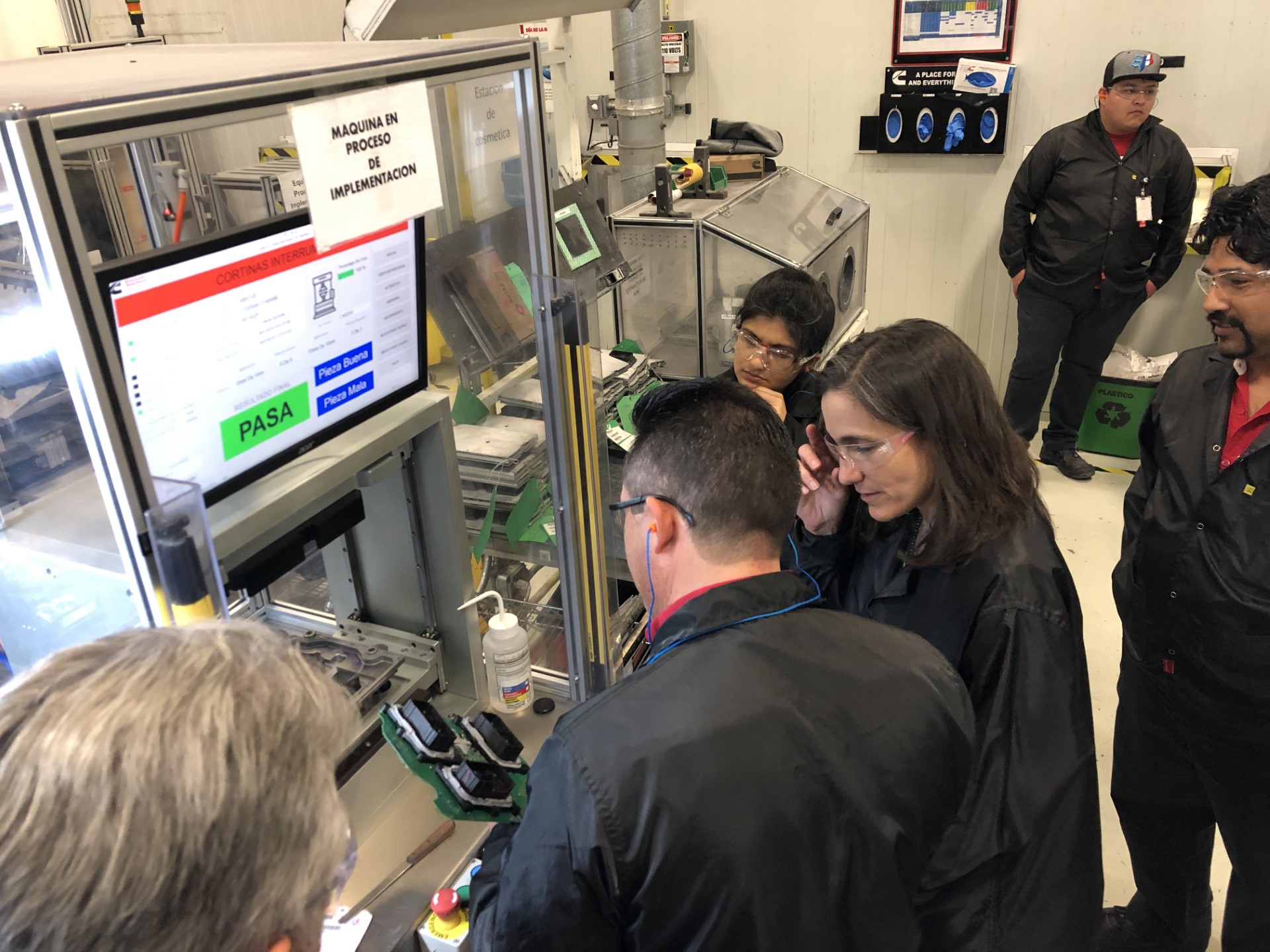 Joan Wills and team at Cummins Juarez remanufacturing facility during a project review