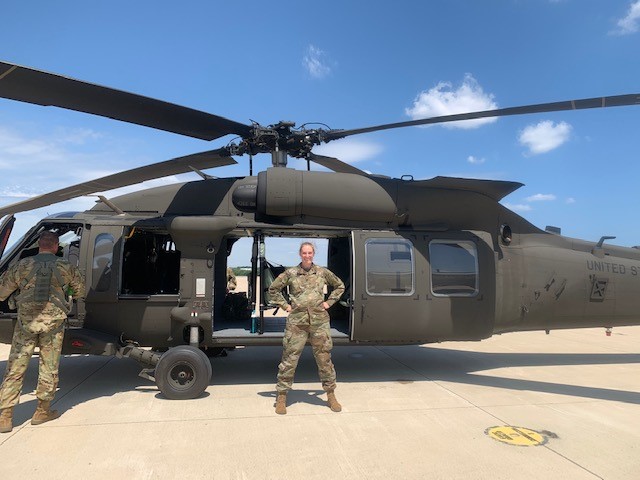 Lindsey with a helicopter at National Guard training