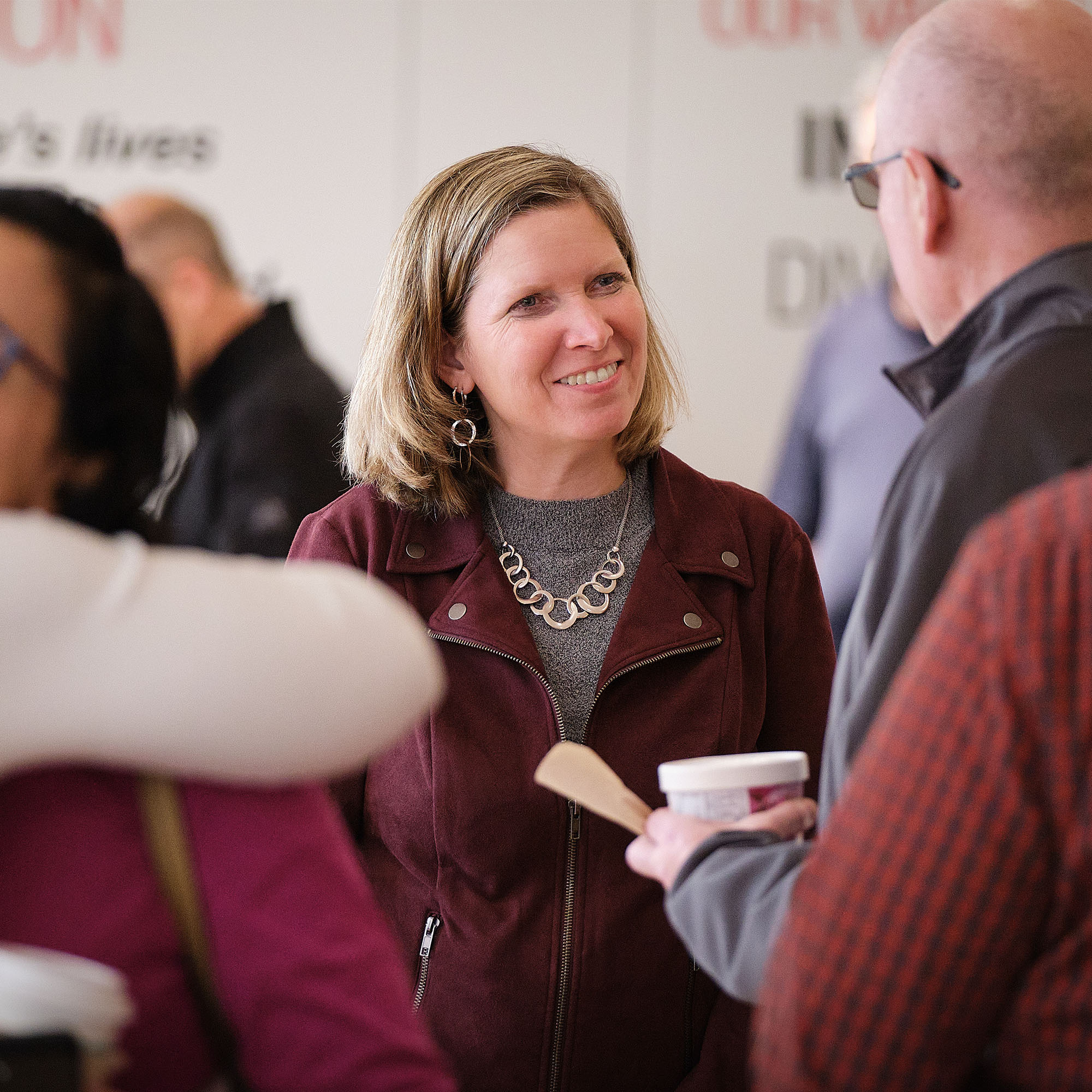 Jen Rumsey talking to employees